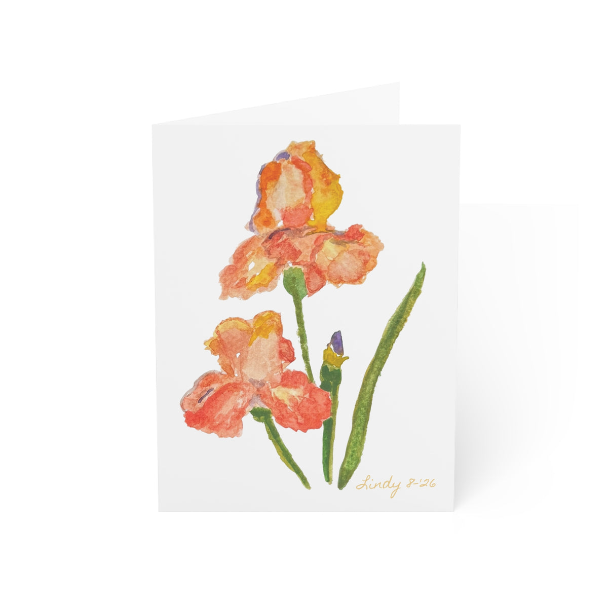 Folded orange iris watercolor card showing the finished cover edge — additional view