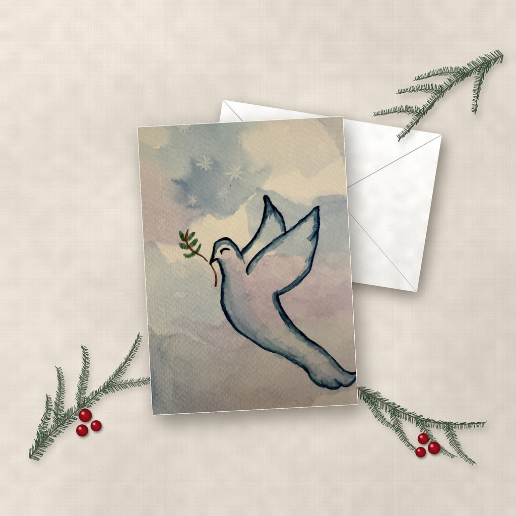 Peace Dove watercolor holiday card on linen with white envelope, pine sprigs and red berries